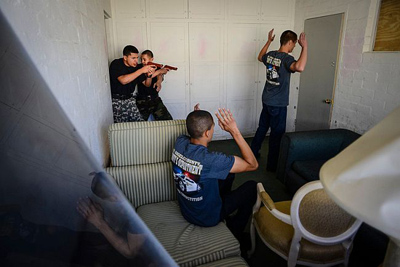 Members of sheriff explorer post 1993 take down "felons" in a drill at Pitchess Detention Center Sunday, March 24, 2013. Law enforcement explorer posts participated in a weekend-long competition to sharpen their skills. (David Crane/Staff Photographer)