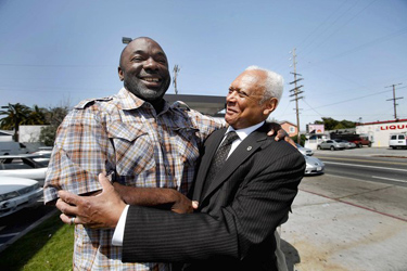 Tray Ware, left, hugs Police Commissioner John Mack at Florence and Normandie avenues, where rioting broke out soon after the verdicts were read in the Rodney King beating case. (Francine Orr, Los Angeles Times / April 5, 2012)