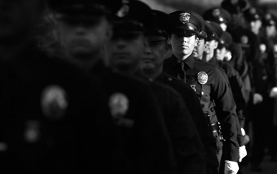 Members of the Los Angeles Police Department recruit class line up for graduation at the LAPD academy in Elysian Park. The class began with 46 recruits, but at the end of their training, only 30 would graduate. (Brian van der Brug)