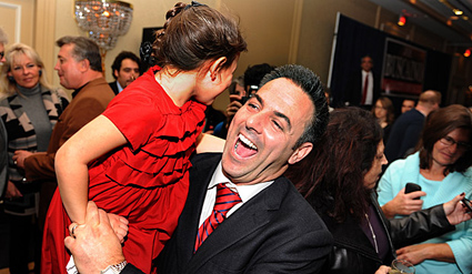 Photo: Joe Buscaino and his daughter celebrate Tuesday at the Crowne Plaza in San Pedro after he took an early lead over Warren Furutani in the race for a City Council seat. Credit: Wally Skalij / Los Angeles Times