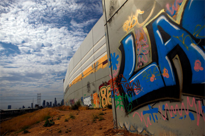 Almost daily, fresh splashes of graffiti are showing up in the San Fernando Valley, on buildings in downtown Los Angeles and on highway billboards. This wall east of downtown Los Angeles is one example. Credit: Eric Thayer for The New York Times