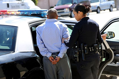 An arrest is made by LAPD officers during a prostitution sting on Wednesday, March 7, 2012 on Lankershim Boulevard in Sun Valley. (Andy Holzman/Daily News Staff Photographer)