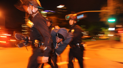 LAPD officers arrest an Occupy L.A. protester near the encampment at City Hall in November. (Wally Skalij, Los Angeles Times / November 29, 2011)