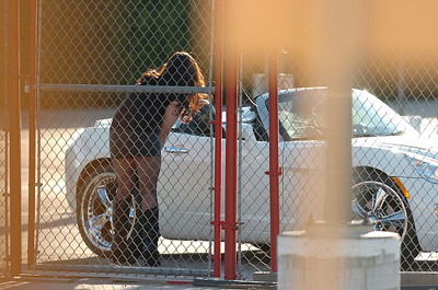 An LAPD officer posing as a prostitute talks to a driver during a sting on Friday, Feb. 17, 2012. The sting is part of an effort by the Devonshire Division to target a crime-ridden 7-square-mile area of the north San Fernando Valley. (Andy Holzman/Staff Photographer)