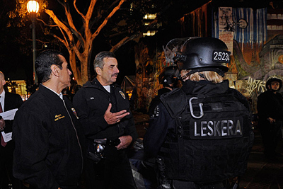Mayor Antonio Villaraigosa, left, and Police Chief Charlie Beck, center, speak with officers in the Occupy Los Angeles encampment following a sweep by the LAPD. Credit: Kevork Djansezian / Getty Images