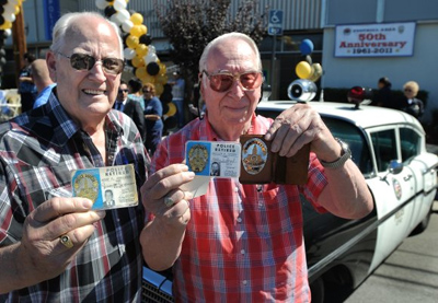 Retired police officers Jery Jorgensen, 74, left, and Phillip Siegel, 84, who worked in the Foothill Division celebrate its 50th anniversary at an open house at the station in Pacoima on Saturday, Oct. 8, 2011. The event included tours and entertainment that included folklorico dancing and a live rock band. Pacoima, CA. (John McCoy/Daily News Staff Photographer)