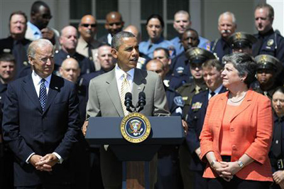 U.S. President Barack Obama (C) stands with Vice President Joe Biden (L) and Homeland Security Secretary Janet Napolitano (R) to honor the 2012 National Association of Police Organizations Top Cops award winners during a ceremony in the Rose Garden at the White House in Washington, May 12, 2012.