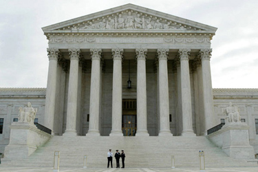 Police officers stand in front of the U.S. Supreme Court in Washington, DC. (Alex Wong / Getty Images / November 8, 2011)