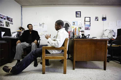 James Croom, left, a counselor at the Watts Healthcare Corp.-House of Uhuru, meets with former prisoner Terrell Barrow, who was released in mid-October after serving three and a half years for drug dealing. Barrow said that during his time at the center, he's learned to better manage his anger and cope with his drug cravings. The cost of his rehabilitation is more than $17,000, none of which is covered by L.A. County. Overall, the House of Uhuru is nearly $280,000 in the red, an agency official said. (Barbara Davidson / Los Angeles Times / April 1, 2012)