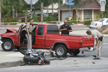 KURT MILLER/STAFF PHOTOGRAPHER CHP officers investiage an accident resulting in a fatality on Pigeon Pass Rd and Chambray Dr. In Moreno Valley on July, 12, 2012