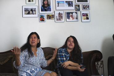 Yolanda Salvador, left, with her niece Brenda Gil speaks about her son's death in her Los Angeles home. (Gina Ferazzi / Los Angeles Times)