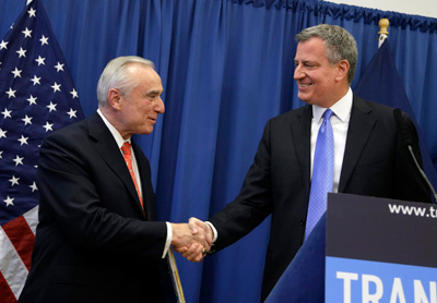 William J. Bratton, left, shakes hands with New York Mayor-elect Bill de Blasio during a news conference in New York on Thursday where Bratton was introduced as the city's next police commissioner. (Seth Wenig / Associated Press / December 5, 2013)