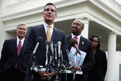 L.A. Mayor Eric Garcetti speaks to the media in Washington, D.C., last week. On Monday, Garcetti said he would seek to restore the Los Angeles Police Department to its authorized force of 10,000 officers. (Alex Wong / Getty Images / January 9, 2014)
